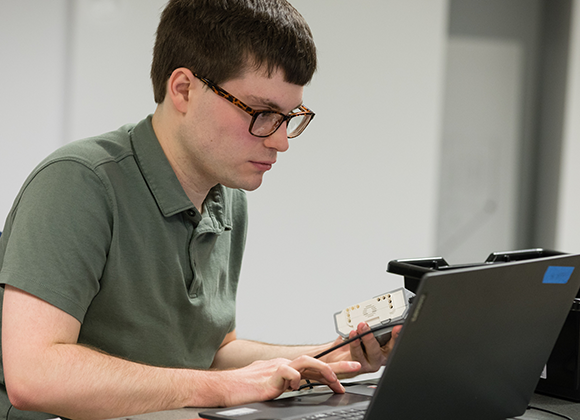 The Precision Institute student at laptop
